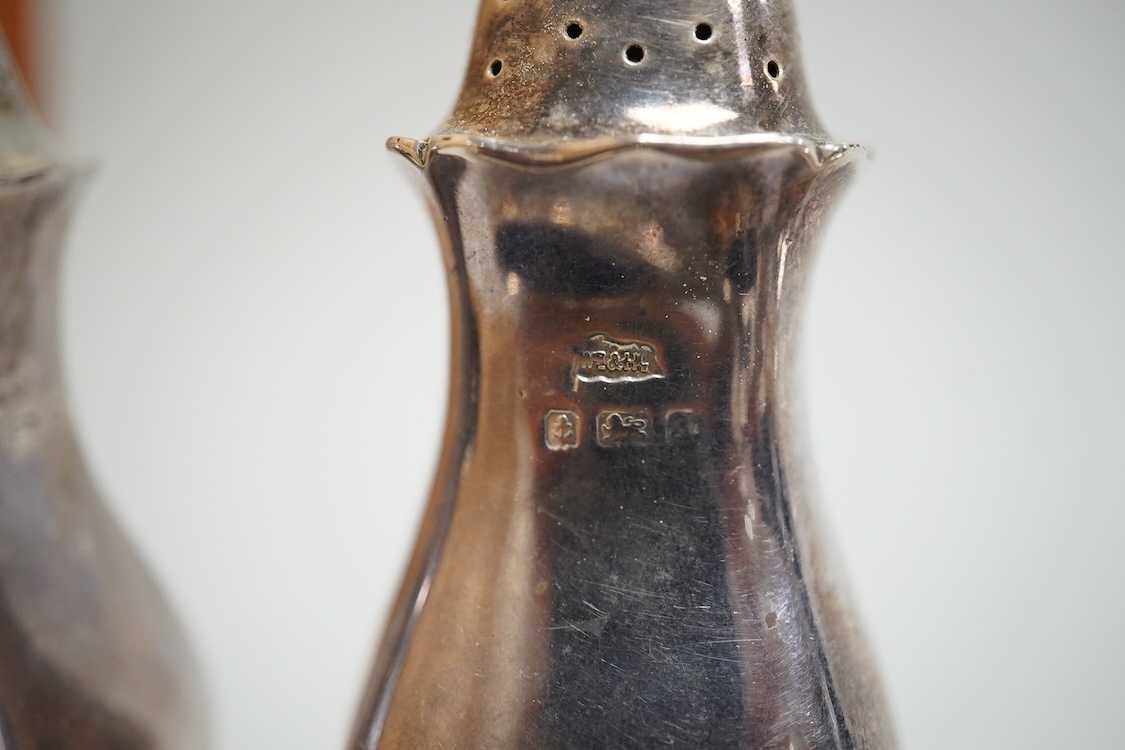 Four assorted silver salts, a silver mustard pot and two silver pepperettes, including Walker & Hall, Birmingham, 1900, some marks rubbed.